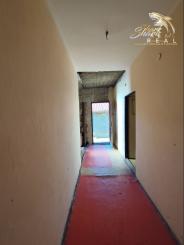 Stavebný pozemok so starším domom na predaj 