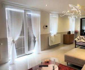 Jedinečná apartmánová nehnutelnosť s bazénom a záhradou