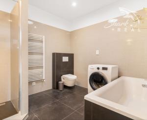 Moderný rodinný dom v radovej zástavbe v obci Malý Lapáš