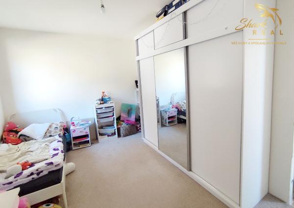 Byt v novostavbe so záhradou neďaleko tajchu a centra mesta